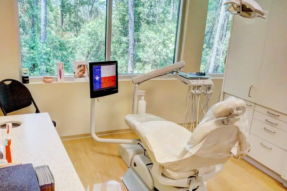 Dental treatment room with chair and technology Woodlands TX dentist office dental exams