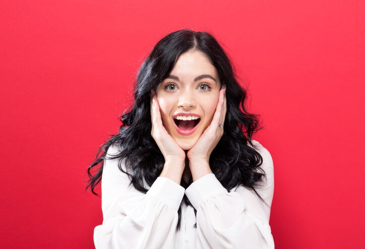 Woman smiling surprised with bright teeth cosmetic dentistry Woodlands TX