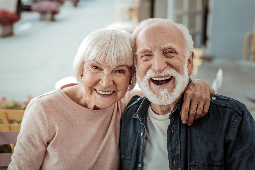 Happy senior couple smiling with healthy smiles family dentist Woodlands TX