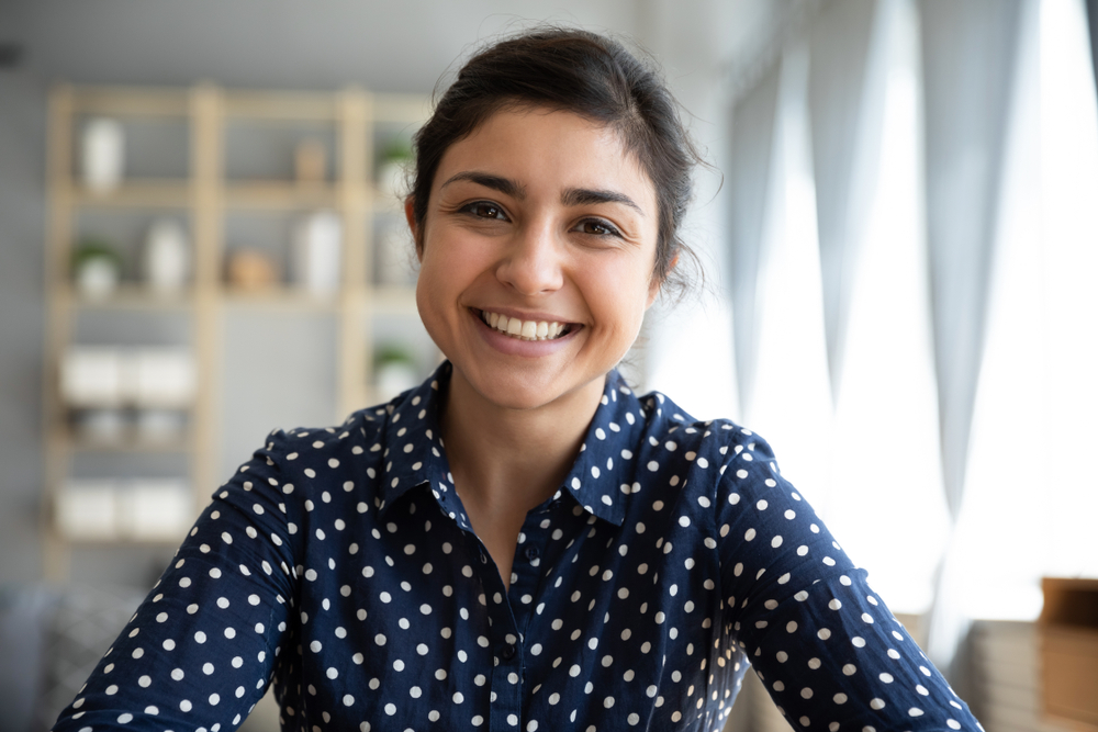 Female patient smiling with healthy teeth Woodlands TX family dentist