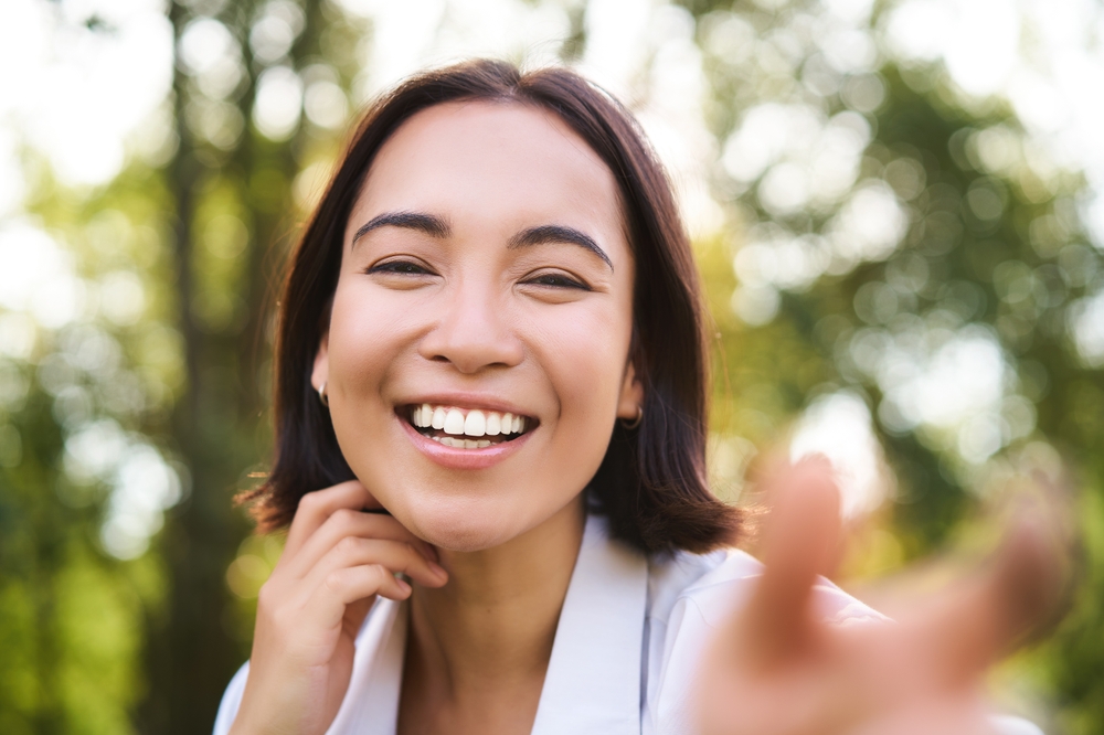 Happy female patient smiling after Wisdom Tooth Extractions in The Woodlands TX