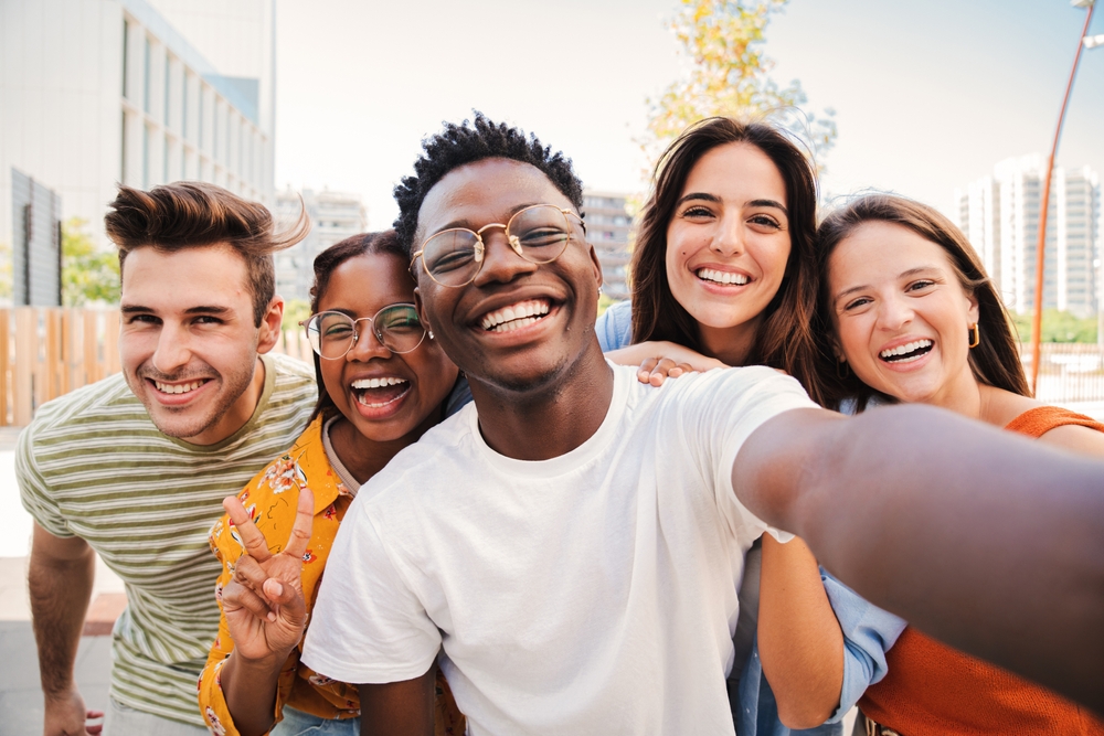 Group of friends smiling together healthy smiles after Dental Exams in The Woodlands TX dentist