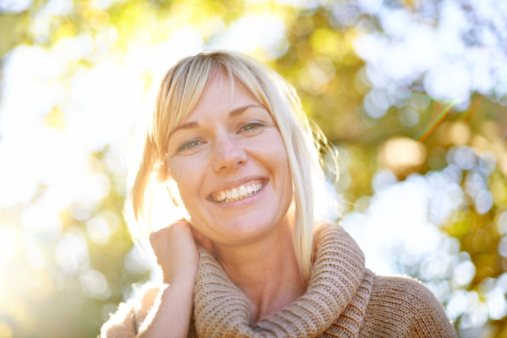 Middle-aged woman smiling confidently with bright healthy smile Woodlands dentist