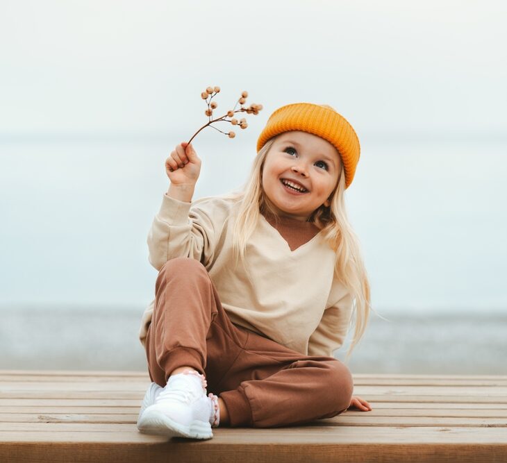 Child smiling happily healthy teeth pediatric dentistry and Oral Cancer Screening in The Woodlands TX