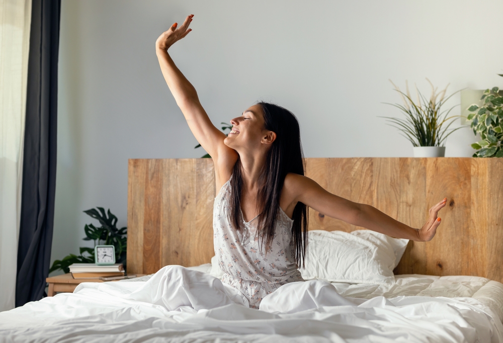 Woman waking up refreshed showing benefits of Sedation Dentistry Woodlands TX