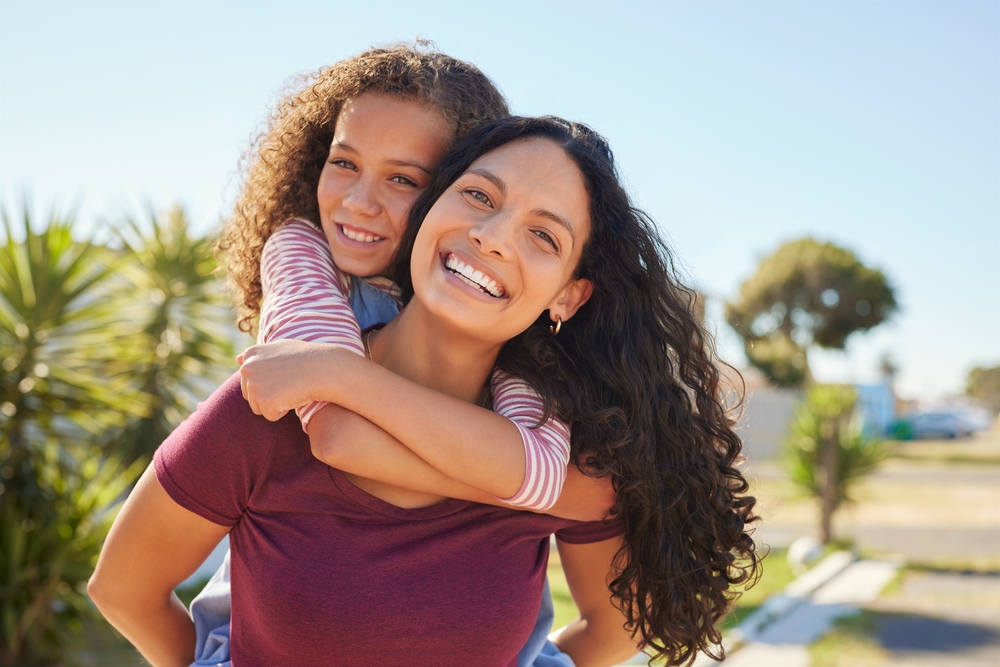Mother and daughter smiling with healthy teeth family dentistry and Gum Disease Treatment Woodlands TX